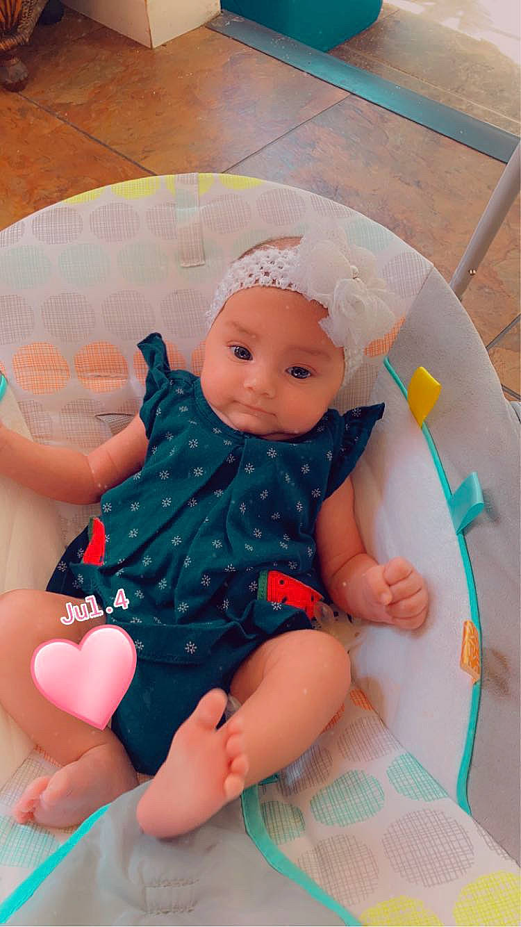 Aurora-rose is registered to the contest to win money with this photo: baby, baby_toddler_clothing, cheek, child, comfort, eye, finger, fun, head, headwear, human_leg, lap, leg, pattern, person, pink, skin, sleeve, sock, textile