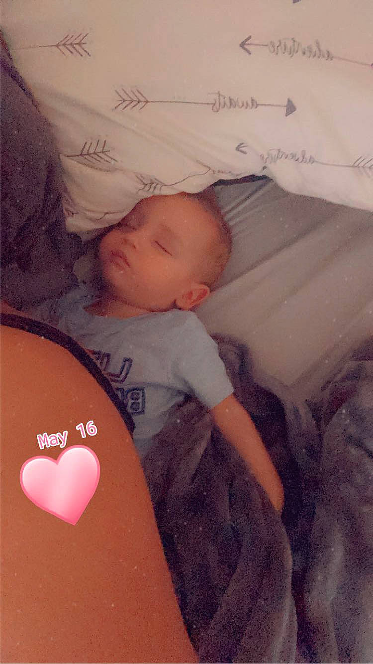 Lucas is registered to the contest to win money with this photo: arm, baby, baby_sleeping, bedtime, cheek, child, comfort, couch, finger, hand, happy, lap, linens, mouth, pattern, person, room, skin, t_shirt, textile