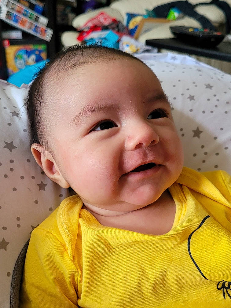 Riku is registered to the contest to win money with this photo: baby, baby_toddler_clothing, cheek, child, chin, collar, eye, eyebrow, eyelash, fun, happy, head, iris, mouth, nose, person, product, skin, sleeve, smile