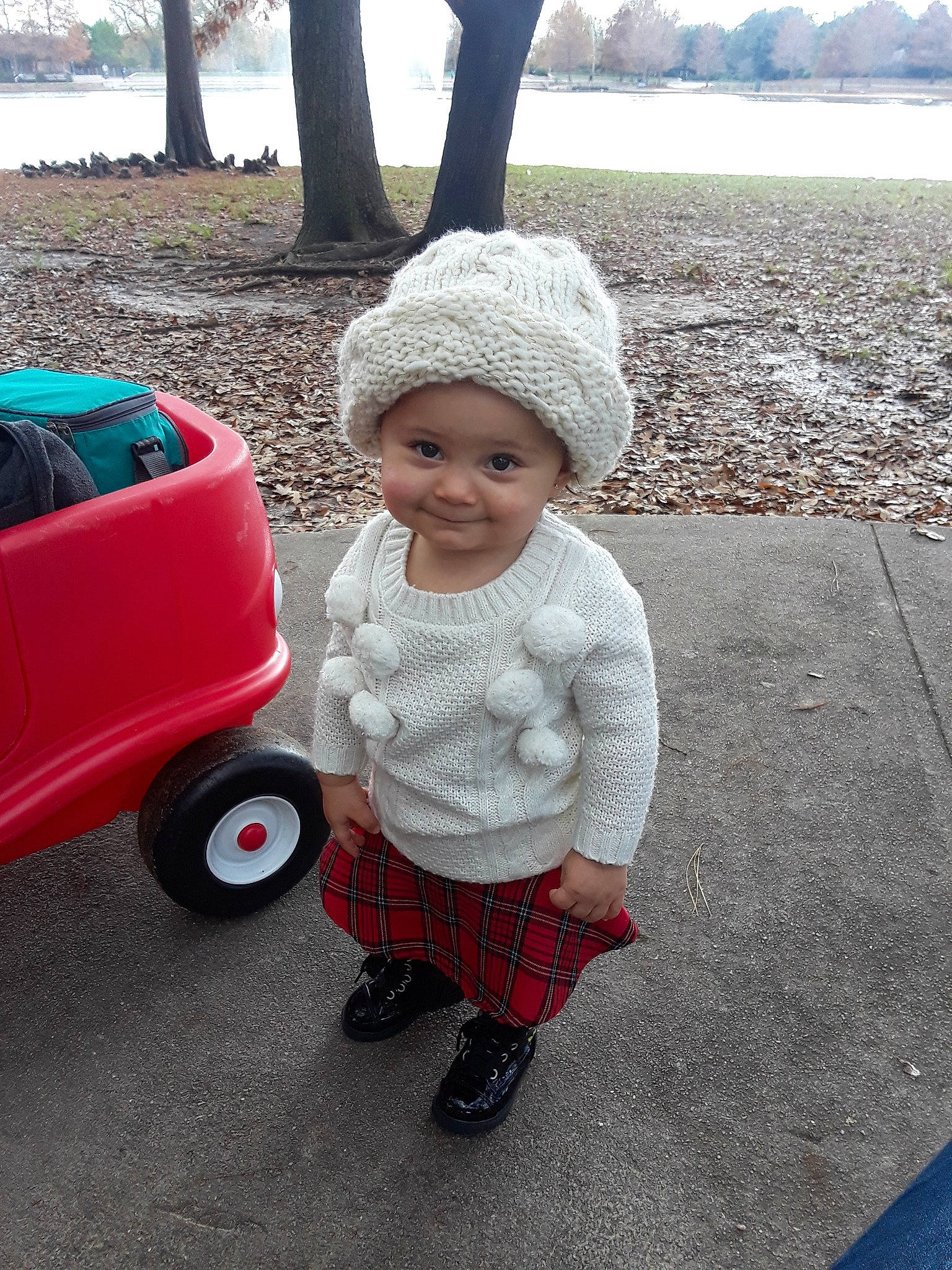 Leah is registered to the contest to win money with this photo: beanie, cap, child, day, fun, fur, hat, headgear, headwear, infant, joy, knitting, person, product, standing, textile, toddler, vacation, winter, wool