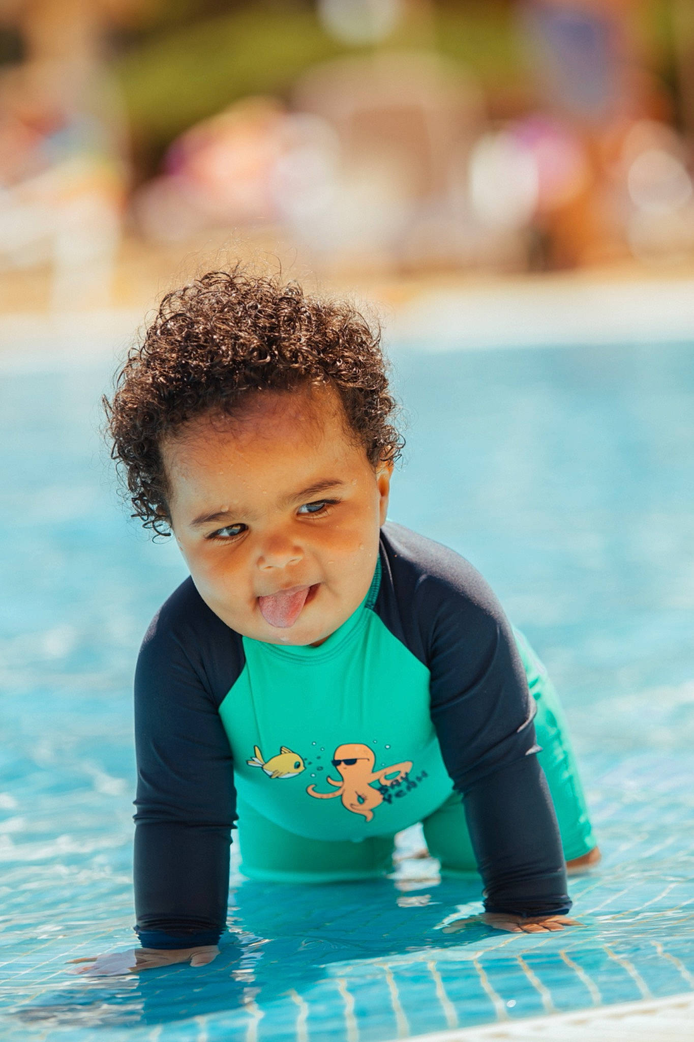 Nahim participe au concours pour gagner de l'argent avec cette photo : aqua, azure, baby, beach, body_of_water, child, eye, face, flash_photography, fun, happy, leisure, people_in_nature, person, photograph, recreation, skin, summer, swimming_pool, toddler