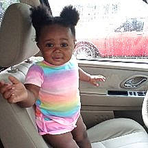 A'Laiyah is registered to the contest to win money with this photo: auto_part, baby, car, car_seat, child, cool, ear, family_car, neck, person, pink, product, seat_belt, sleeve, toddler, vehicle, vehicle_door