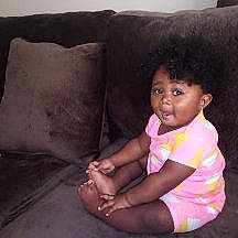 A'Laiyah joined the competition — help win amazing prizes! baby, bedding, cheek, child, cushion, finger, furniture, head, human, leg, linens, person, pink, play, sitting, skin, smile, textile, thigh, thumb