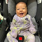 Adeline joined the competition — help win amazing prizes! baby, car_seat, smiling, infant, onesie, nike, happy, child, seatbelt, clothing, indoor, cute, person, sitting, portrait, face, straps, safety, expression, comfort
