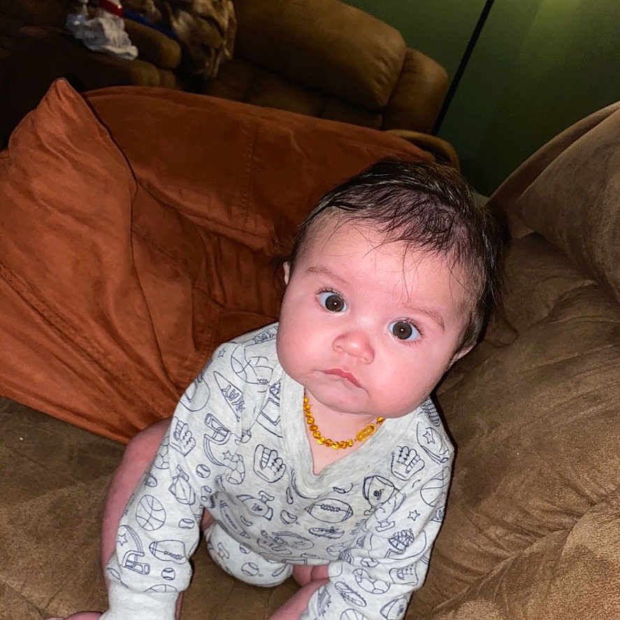 Dacoda joined the competition — help win amazing prizes! architecture, baby, bodypart, building, clothing, couch, cushion, face, finger, furniture, hand, head, homedecor, indoors, livingroom, pants, person, photography, portrait, room