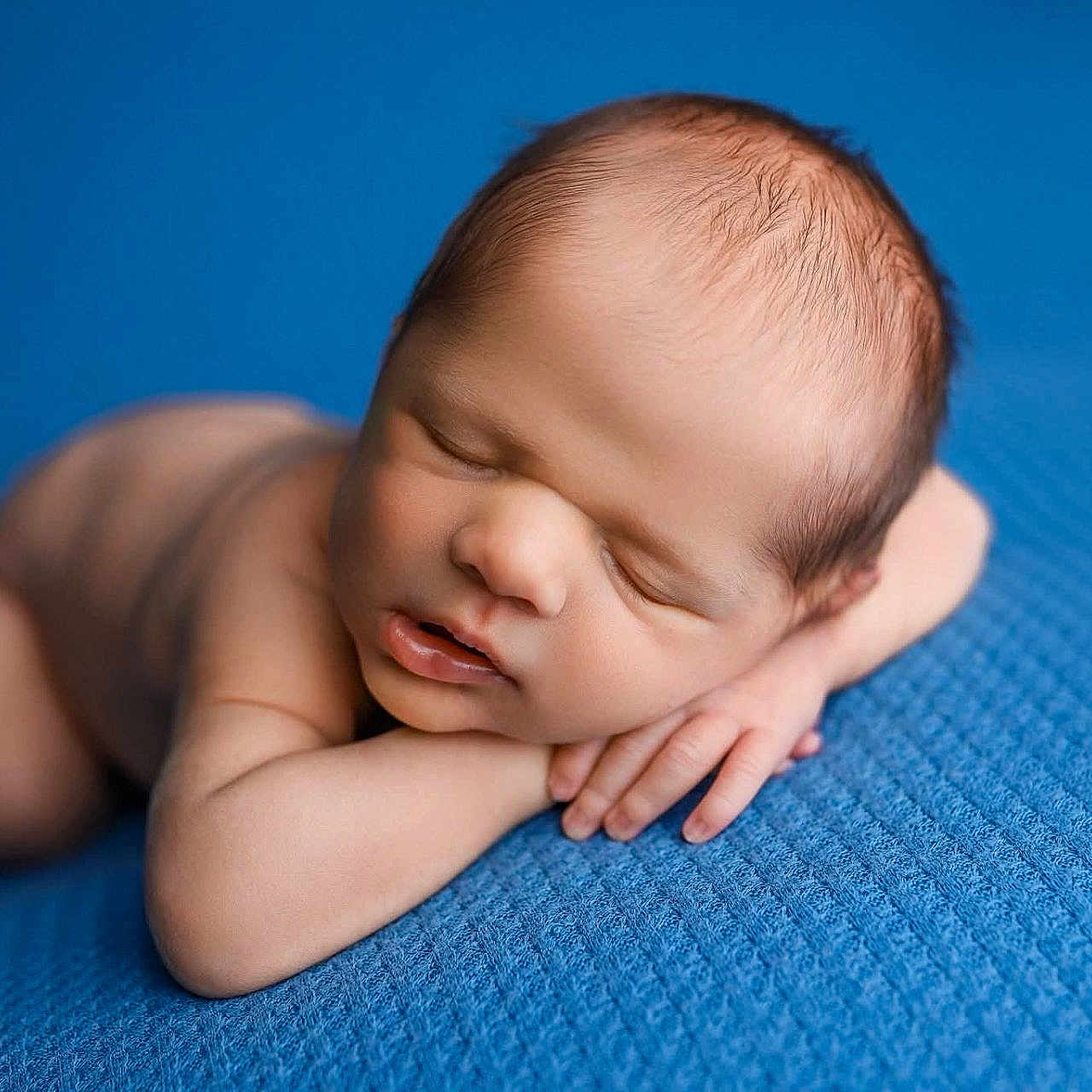 Raylan joined the competition — help win amazing prizes! baby, blue_blanket, closeup, cute, face, hands, head, indoors, infant, lying_down, newborn, peaceful, portrait, resting, skin, sleeping, small, soft_light, texture, young_child