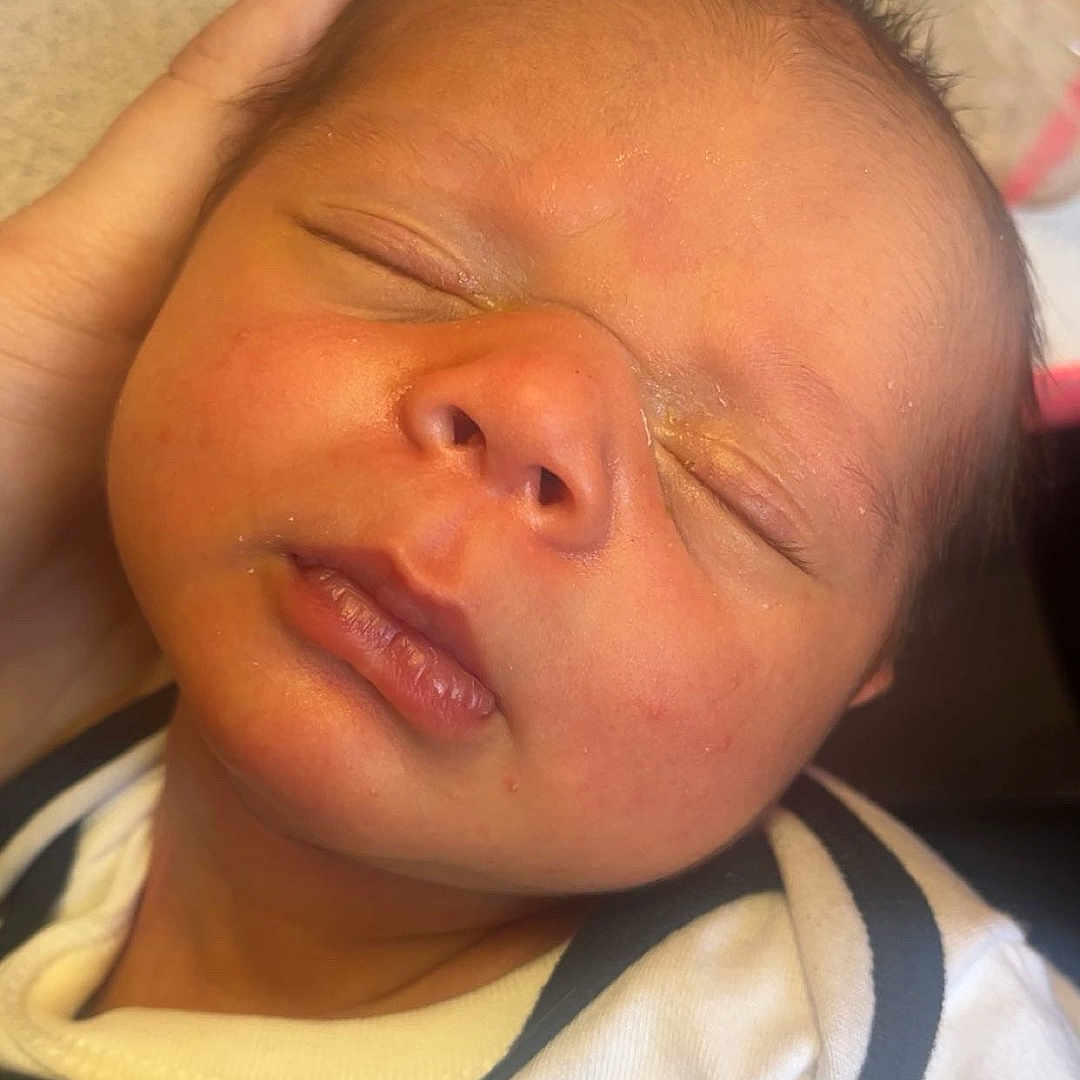 Hudson Denver Smith is registered to the contest to win money with this photo: architecture, baby, bed, bedroom, blanket, building, clothing, cushion, face, furniture, glove, head, homedecor, hospital, newborn, person, photography, portrait, quilt, sleeping