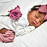 adorable, baby, child, closeup, cute, flower, headband, infant, knitted_pants, newborn, peaceful, pink_bow, pink_rose, portrait, resting, sleep, sleeping, soft_texture, white_blanket, white_clothing