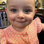 Laylin is registered to the contest to win money with this photo: baby, child, smile, face, eyes, dress, pink, pattern, cute, indoor, portrait, person, infant, young, happy, closeup, apparel, skin, head, expression