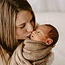 Colter joined the competition — help win amazing prizes! baby, newborn, woman, kiss, affection, love, tenderness, blanket, knitted, closeup, portrait, indoor, warm, skin, face, person, mother, family, care, cuddle