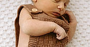 Colter is registered to the contest to win money with this photo: baby, blanket, brown_clothing, child, closeup, cozy, cute, indoors, infant, knitted_outfit, newborn, newborn_baby, peaceful, person, portrait, relaxation, resting, sleep, sleeping, soft_texture