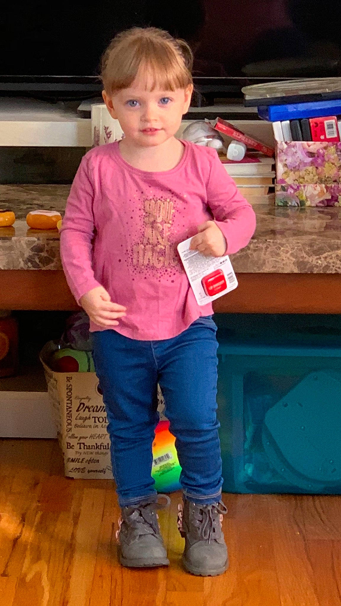 Chelsea is registered to the contest to win money with this photo: child, child_model, denim, footwear, jeans, leg, outerwear, person, play, shoe, sleeve, standing, t_shirt, toddler, trousers