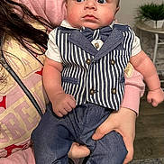 Amias joined the competition — help win amazing prizes! baby, child, person, indoor, clothing, vest, bow_tie, holding, hand, face, cute, blue_eyes, pants, socks, striped, casual, portrait, expression, young, person_holding