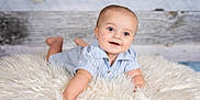 Amias joined the competition — help win amazing prizes! baby, blue_eyes, smiling, fluffy_rug, striped_shirt, lying_down, curious, happy, indoor, portrait, infant, cute, child, wooden_background, soft_texture, crawling, head_up, baby_clothes, closeup, skin