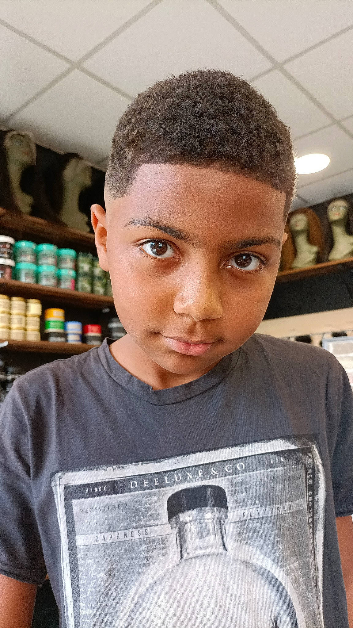 Daniel participe au concours pour gagner de l'argent avec cette photo : active_shirt, black, black_hair, buzz_cut, caesar_cut, cheek, child, crew_cut, crop, drink, eyebrow, eyelash, forehead, fun, happy, jaw, person, plastic_bottle, portrait_photography, t_shirt