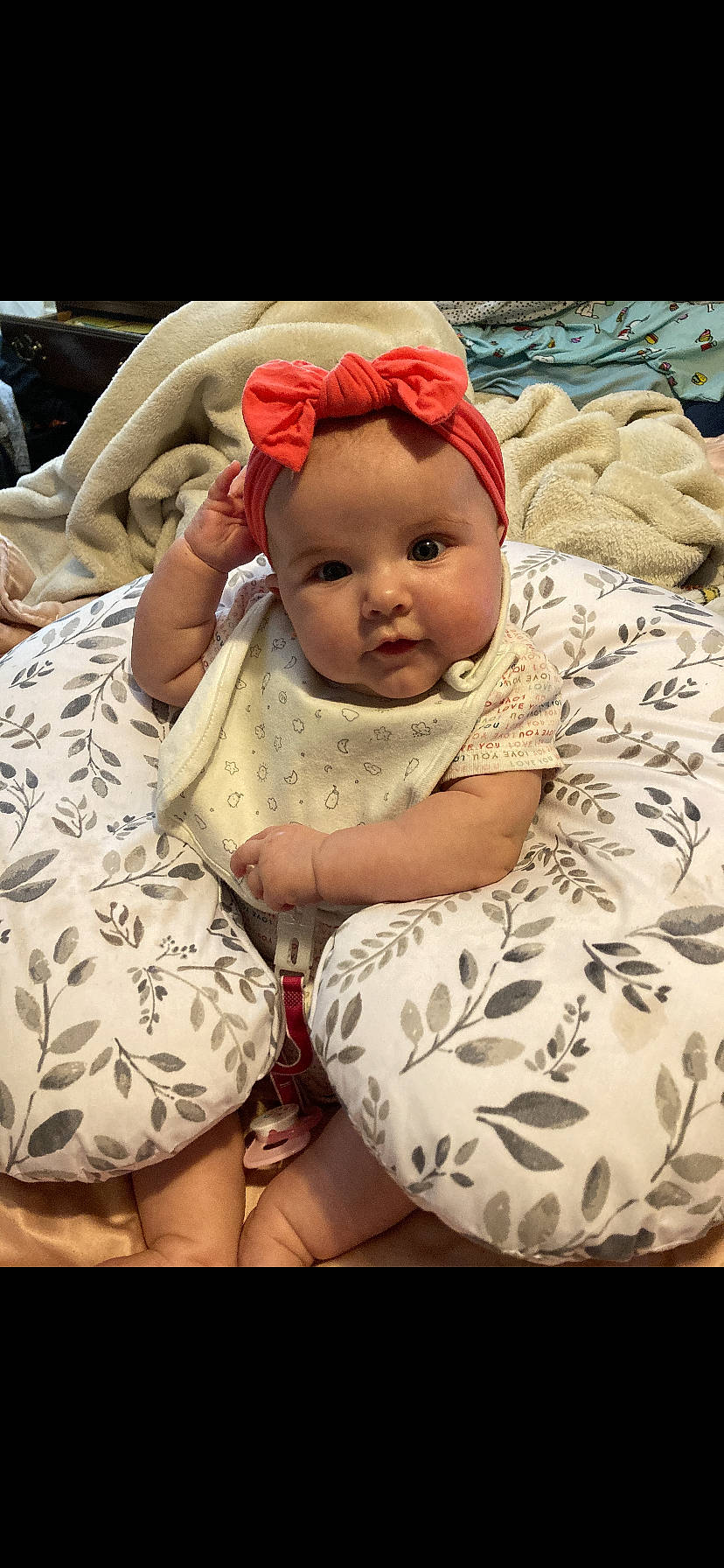 Adalynn is registered to the contest to win money with this photo: baby, baby_products, baby_sleeping, baby_toddler_clothing, cap, cheek, child, comfort, face, fashion_accessory, foot, happy, headgear, human_leg, linens, pattern, person, sitting, sleeve, thigh
