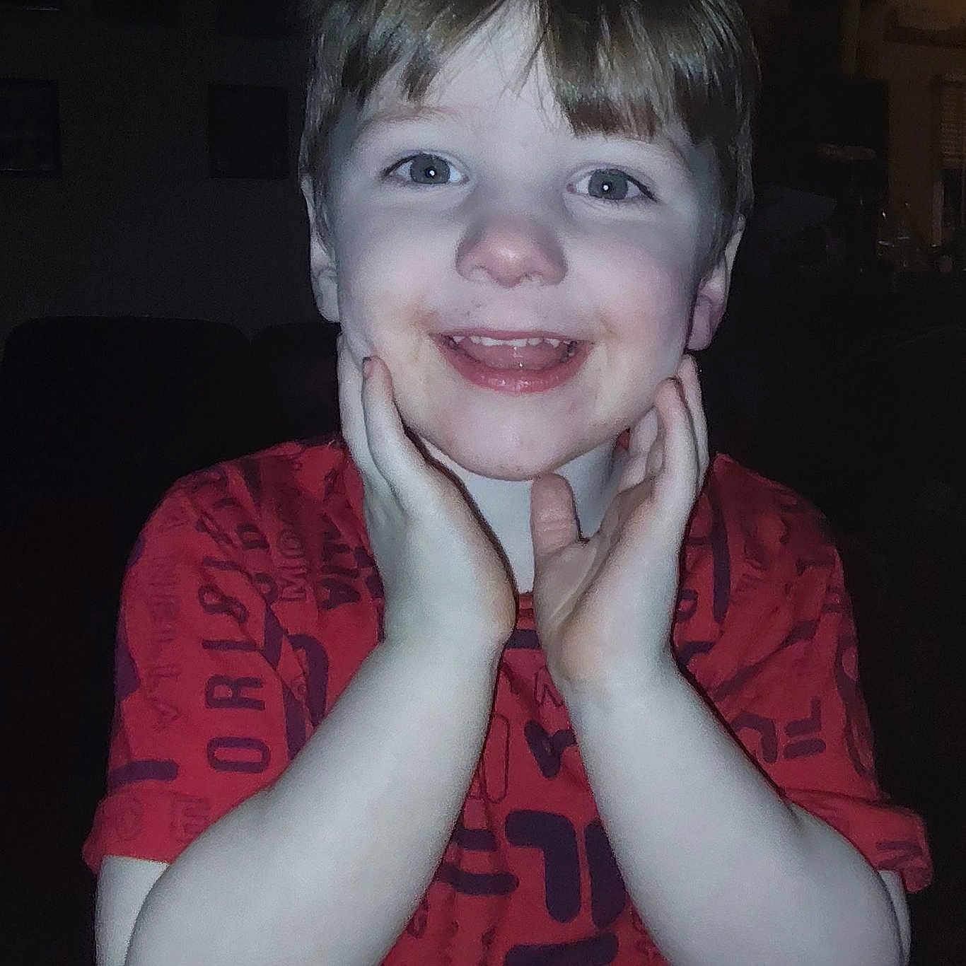 Hunter is registered to the contest to win money with this photo: accessories, baby, bodypart, clothing, face, finger, hand, happy, head, indoors, laughing, mouth, person, photography, portrait, shirt, smile, t_shirt, teeth, urban