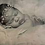 baby, newborn, sleeping, black_and_white, pearl_headband, portrait, soft_texture, feathers, peaceful, infant, closeup, cute, resting, tulle, skin, head, face, calm, adorable, soft_lighting