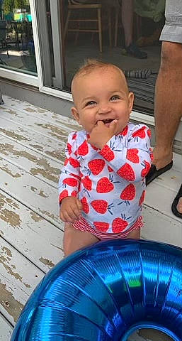 Kya is registered to the contest to win money with this photo: baby, baby_toddler_clothing, blue, cheek, child, eye, face, fun, happy, head, iris, joy, leisure, people, person, photograph, product, shorts, skin, smile