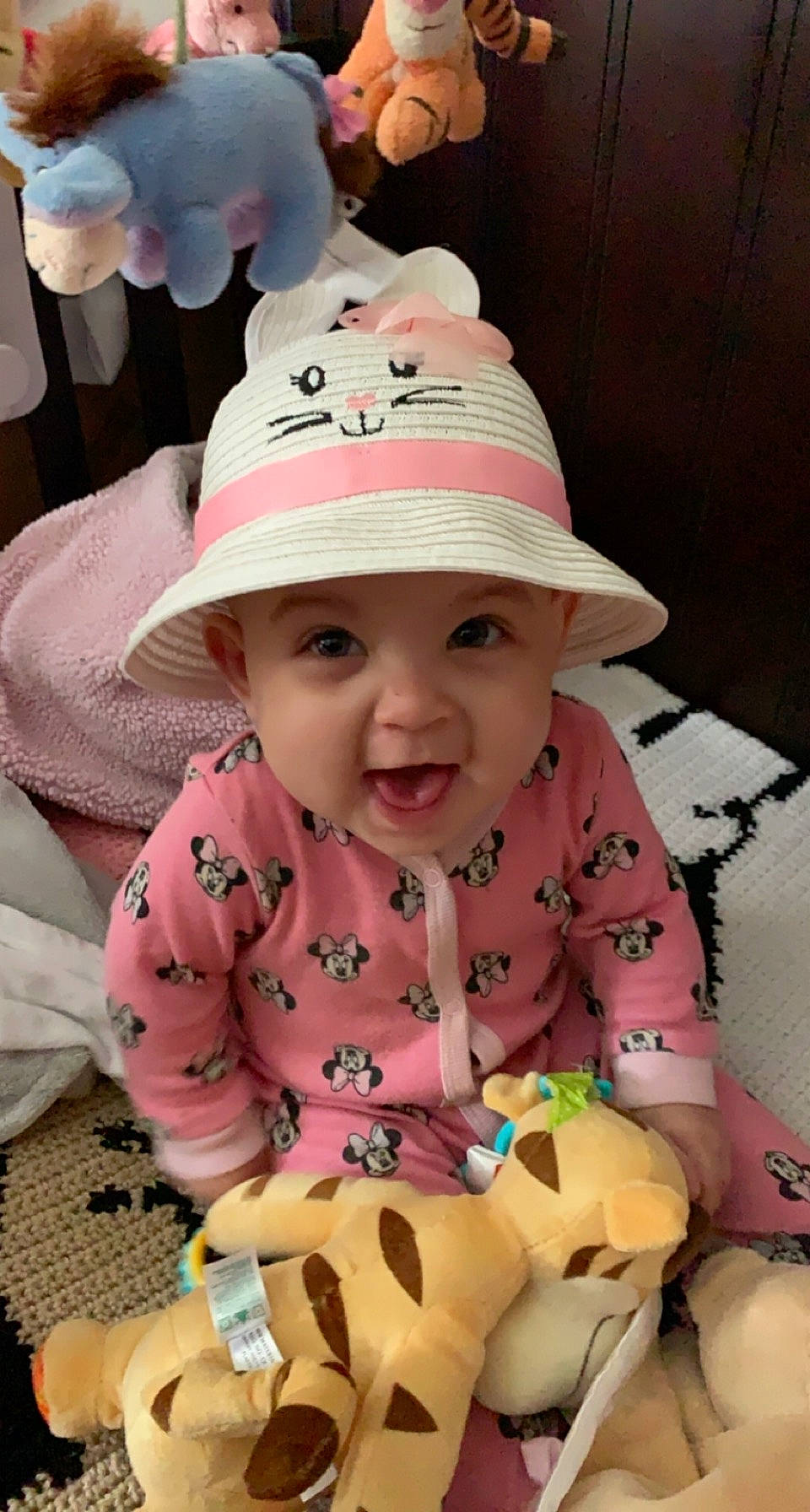 Kya is registered to the contest to win money with this photo: baby, baby_toddler_clothing, cap, cheek, child, face, football, fun, happy, hat, headwear, mammal, person, pink, product, skin, smile, textile, toddler, toy