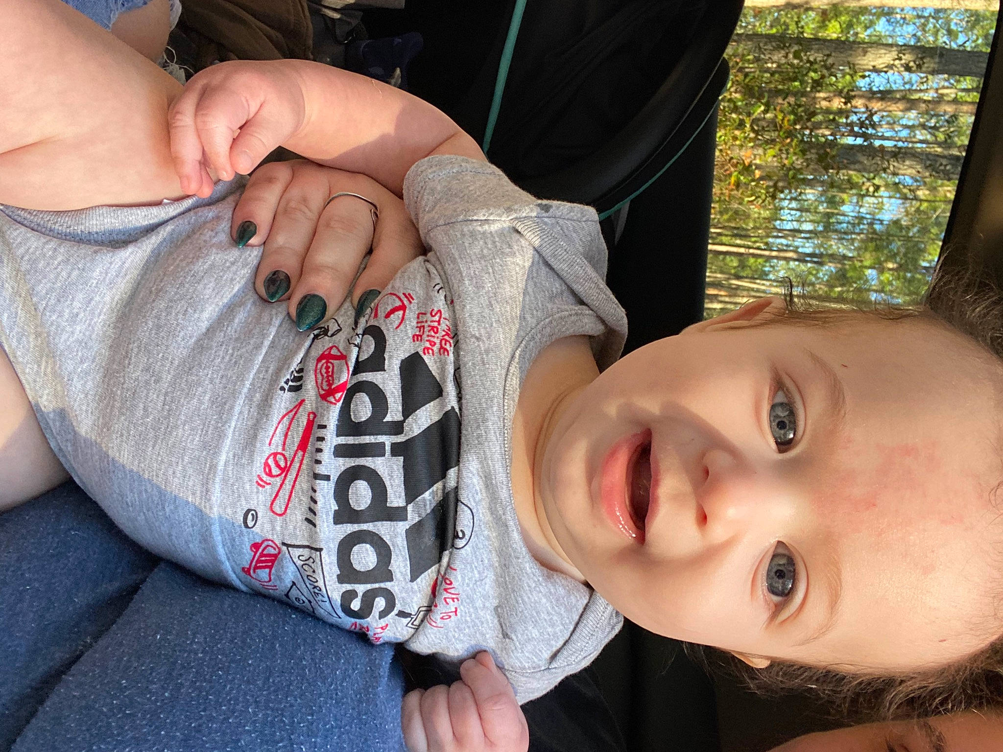 Eli joined the competition — help win amazing prizes! cheek, cool, eye, eyelash, finger, gesture, grass, happy, human_body, lip, mammal, mouth, neck, nose, person, plant, skin, smile, toddler, tree