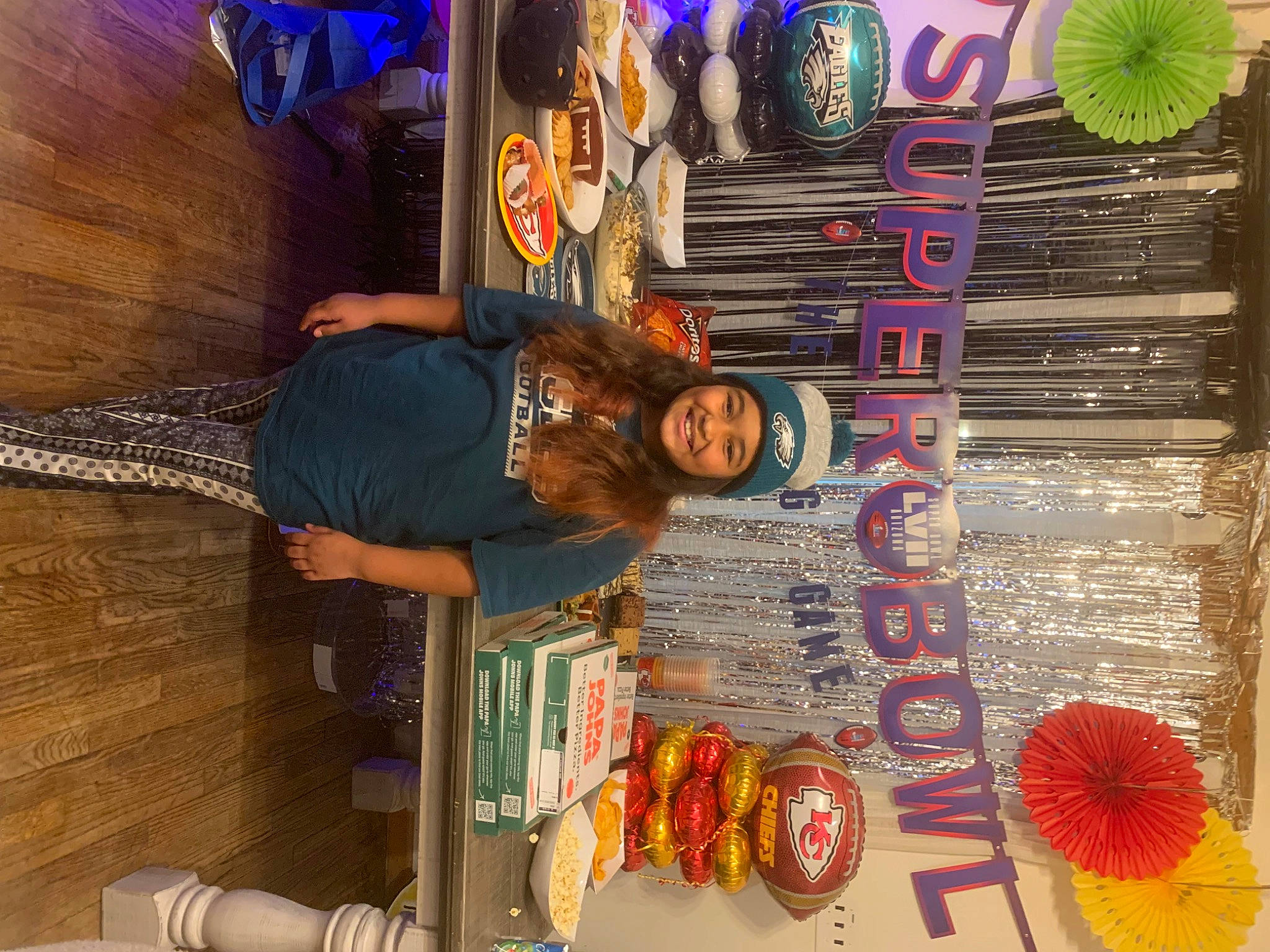 Alanna is registered to the contest to win money with this photo: art, artist, collection, fashion_accessory, fun, hat, headwear, joy, magenta, person, photography, room, smile, snapshot, t_shirt, textile, visual_arts, wheel, wood