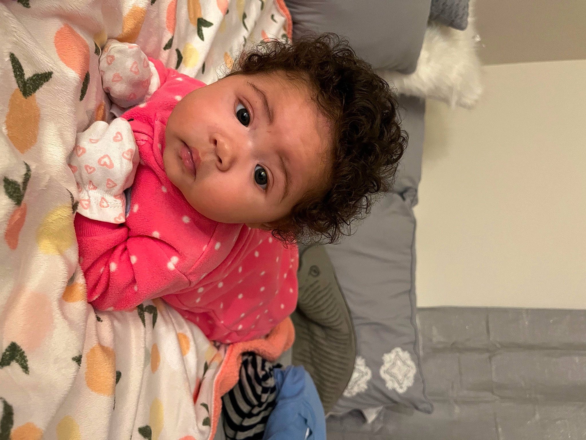 Ariah is registered to the contest to win money with this photo: baby, baby_toddler_clothing, cheek, child, comfort, event, fun, fur, happy, pattern, person, pink, room, sitting, skin, smile, toddler, white