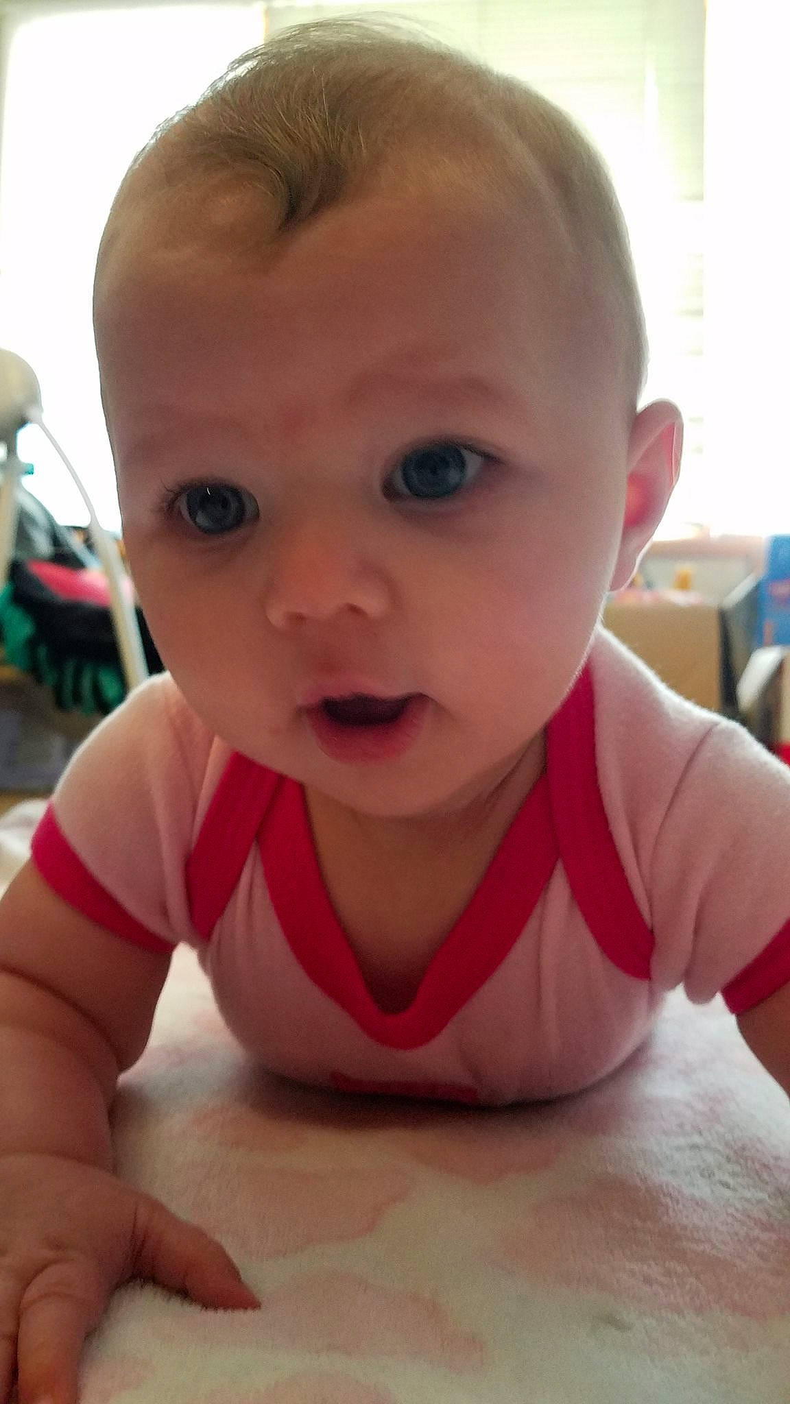 Layla is registered to the contest to win money with this photo: baby, baby_making_funny_faces, cheek, child, chin, crawling, eye, eyebrow, face, facial_expression, finger, forehead, fun, head, lip, mouth, nose, person, skin, toddler