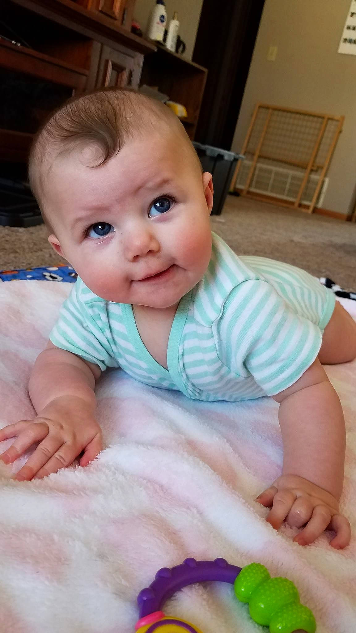 Layla joined the competition — help win amazing prizes! baby, baby_toddler_clothing, cheek, child, eye, face, finger, head, iris, lip, nose, person, sitting, skin, smile, toddler, tummy_time