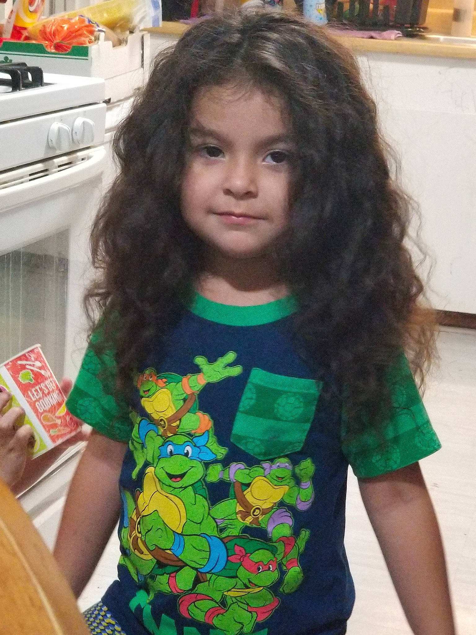 Celia is registered to the contest to win money with this photo: bangs, black_hair, brown_hair, child, cool, face, forehead, hair, hair_coloring, hairstyle, head, long_hair, neck, person, shoulder, sleeve, t_shirt, top