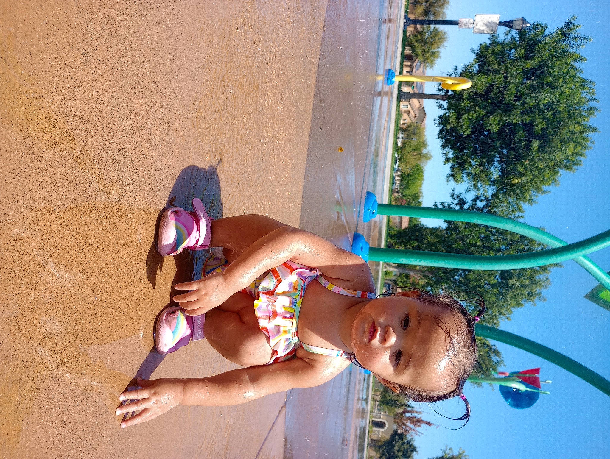 Monica is registered to the contest to win money with this photo: elbow, electric_blue, eyewear, fun, happy, hat, human_leg, knee, leisure, person, plant, pole, recreation, sky, smile, sunglasses, swimwear, thigh, tree, trunk