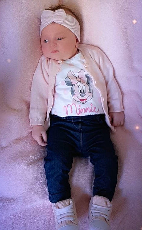 Mia participe au concours pour gagner de l'argent avec cette photo : baby, baby_toddler_clothing, cheek, child, headgear, headwear, outerwear, person, pink, product, skin, sleeve, toddler, white