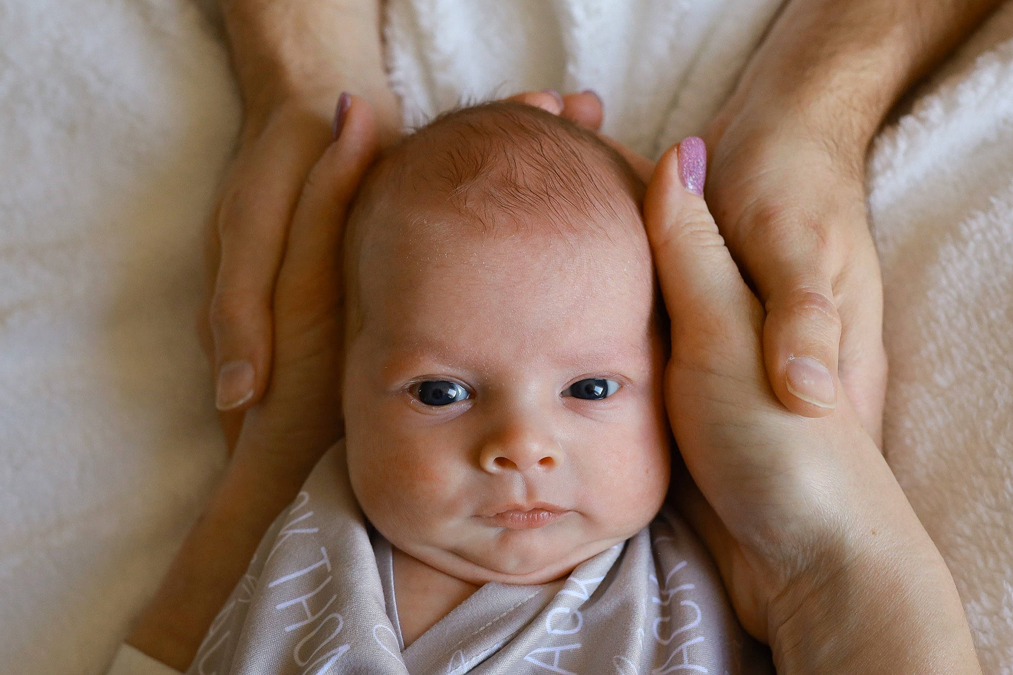 Jack is registered to the contest to win money with this photo: baby, cheek, chin, comfort, ear, eye, eyebrow, face, facial_expression, finger, gesture, hand, human, iris, lip, mammal, mouth, nose, person, product