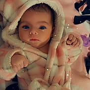 Lilith joined the competition — help win amazing prizes! baby, infant, hooded_robe, pink, blanket, pacifier, cozy, soft_texture, indoor, cute, portrait, child, newborn, sleepwear, plush, fuzzy, face, hands, lying_down, star_effects