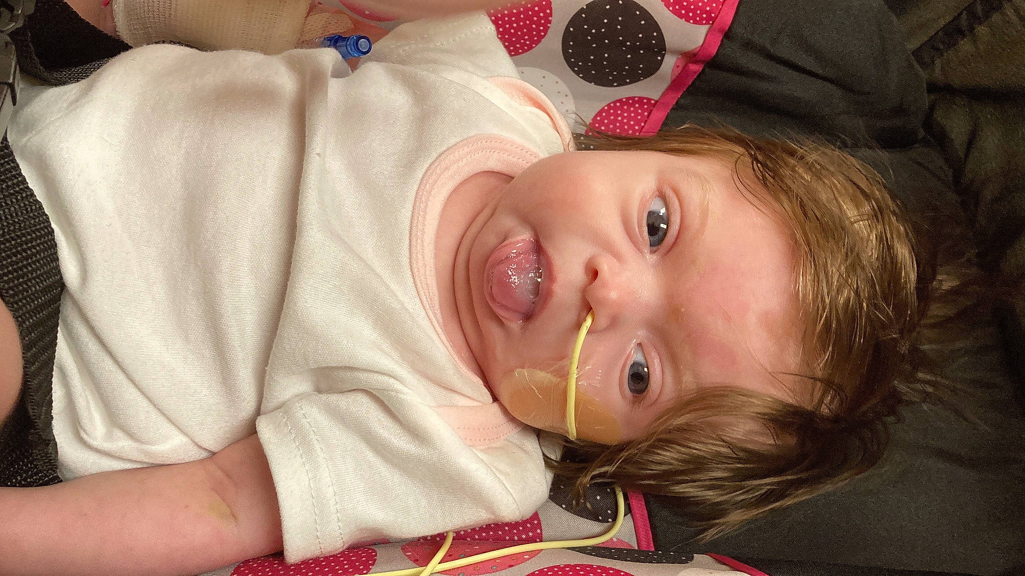 Kensley is registered to the contest to win money with this photo: baby, baby_toddler_clothing, cheek, chin, eye, eyebrow, eyelash, face, happy, hat, head, headgear, iris, lip, mouth, nose, person, red, skin, smile