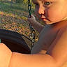 Zayden joined the competition — help win amazing prizes! toddler, child, tire_swing, outdoor, sunlight, chain, nature, baby, playground, summer, skin, closeup, portrait, greenery, diaper, baby_skin, daylight, expression, park, leaves