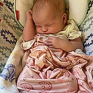 Khaleesi joined the competition — help win amazing prizes! baby, newborn, sleeping, blanket, pink, heart_pattern, rainbow_pattern, baby_seat, cushion, zigzag_pattern, infant, soft, cozy, cute, peaceful, child, resting, clothing, indoors, portrait