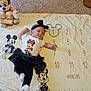 Khaleesi is registered to the contest to win money with this photo: baby, infant, mickey_mouse, minnie_mouse, plush_toy, milestone_blanket, carpet, clothing, headband, tutu, socks, numbers, months, cute, child, person, floor, celebration, smile, toy