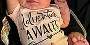 Khaleesi joined the competition — help win amazing prizes! baby, infant, onesie, car_seat, smile, happy, face, feet, arms, clothing, child, person, cute, newborn, skin, sitting, closeup, indoor, expression, resting