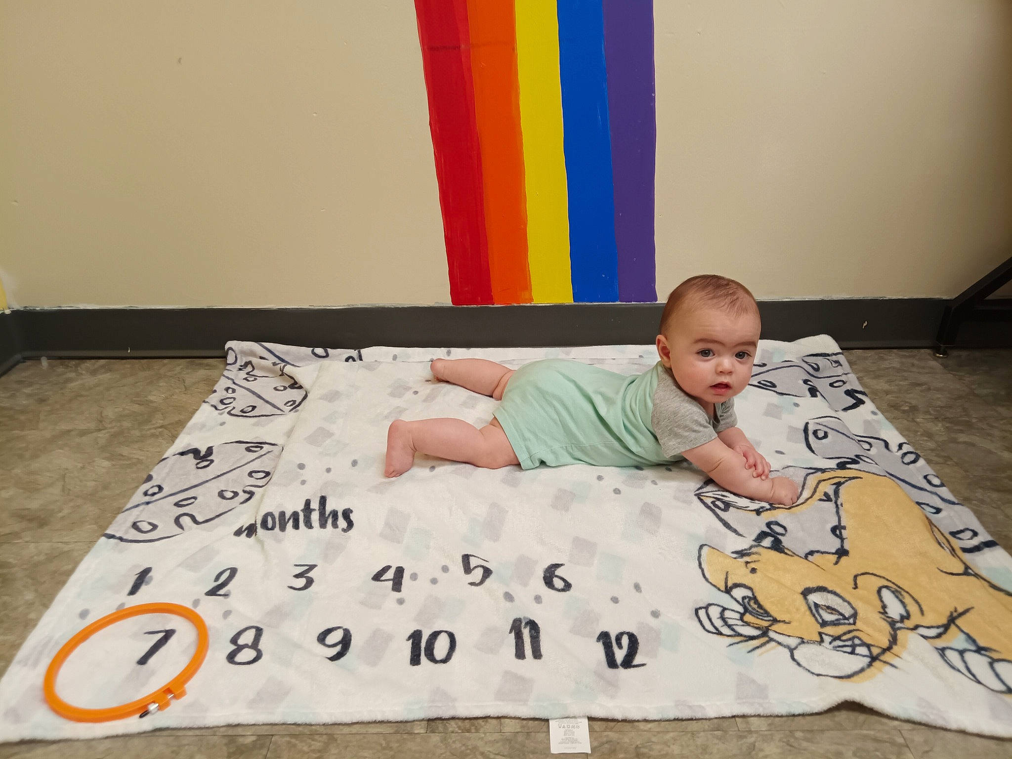 Elijah joined the competition — help win amazing prizes! baby, baby_toddler_clothing, bedding, bedtime, child, comfort, floor, flooring, font, grass, happy, linens, pattern, person, play, rectangle, room, sitting, t_shirt, toddler