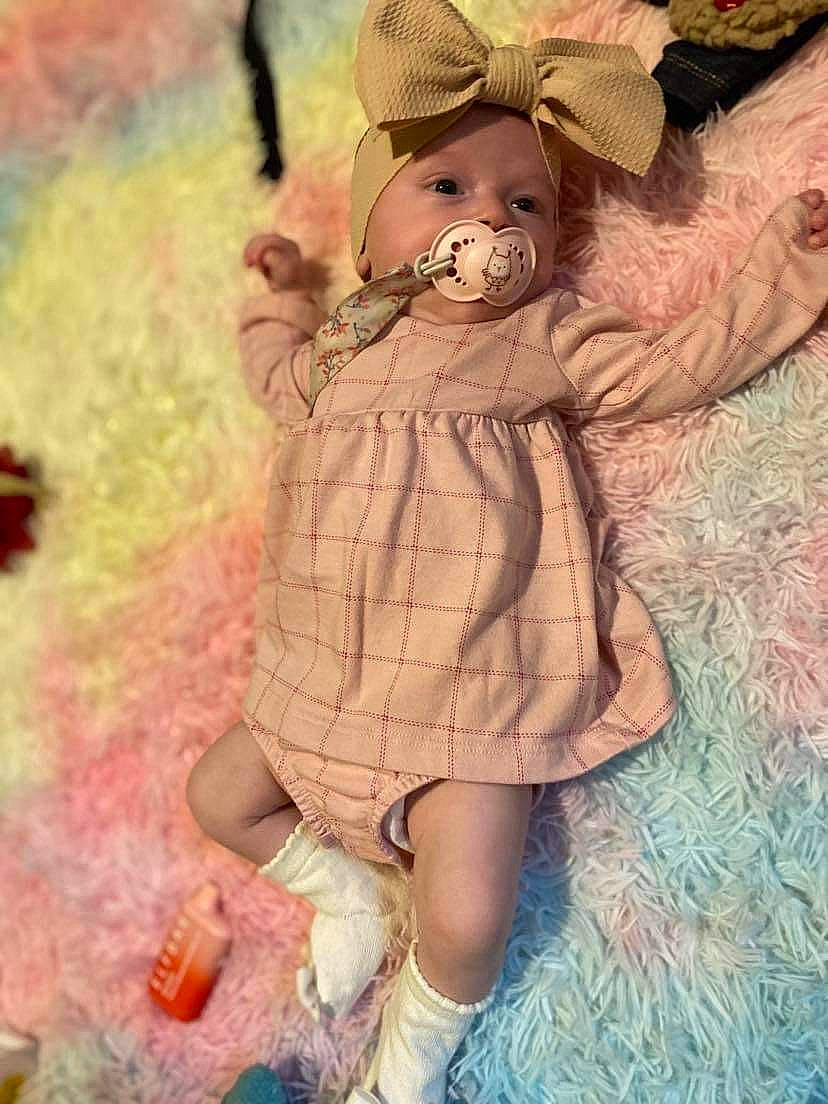 Hadleigh joined the competition — help win amazing prizes! art, baby_toddler_clothing, brown_hair, doll, dress, fawn, fictional_character, fur, happy, hat, illustration, pattern, peach, person, petal, pink, plant, teddy_bear, toddler, toy