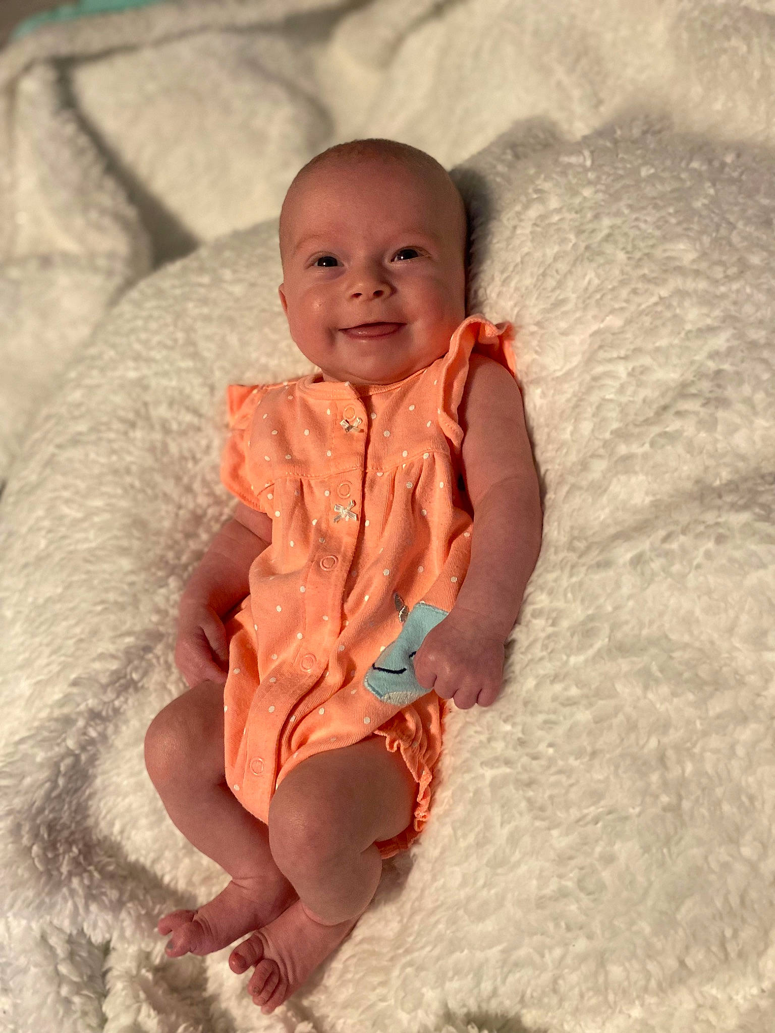 Hadleigh is registered to the contest to win money with this photo: abdomen, baby, baby_toddler_clothing, chest, child, comfort, event, foot, fun, happy, human_leg, joy, leg, linens, person, sitting, skin, sleeve, smile, stomach