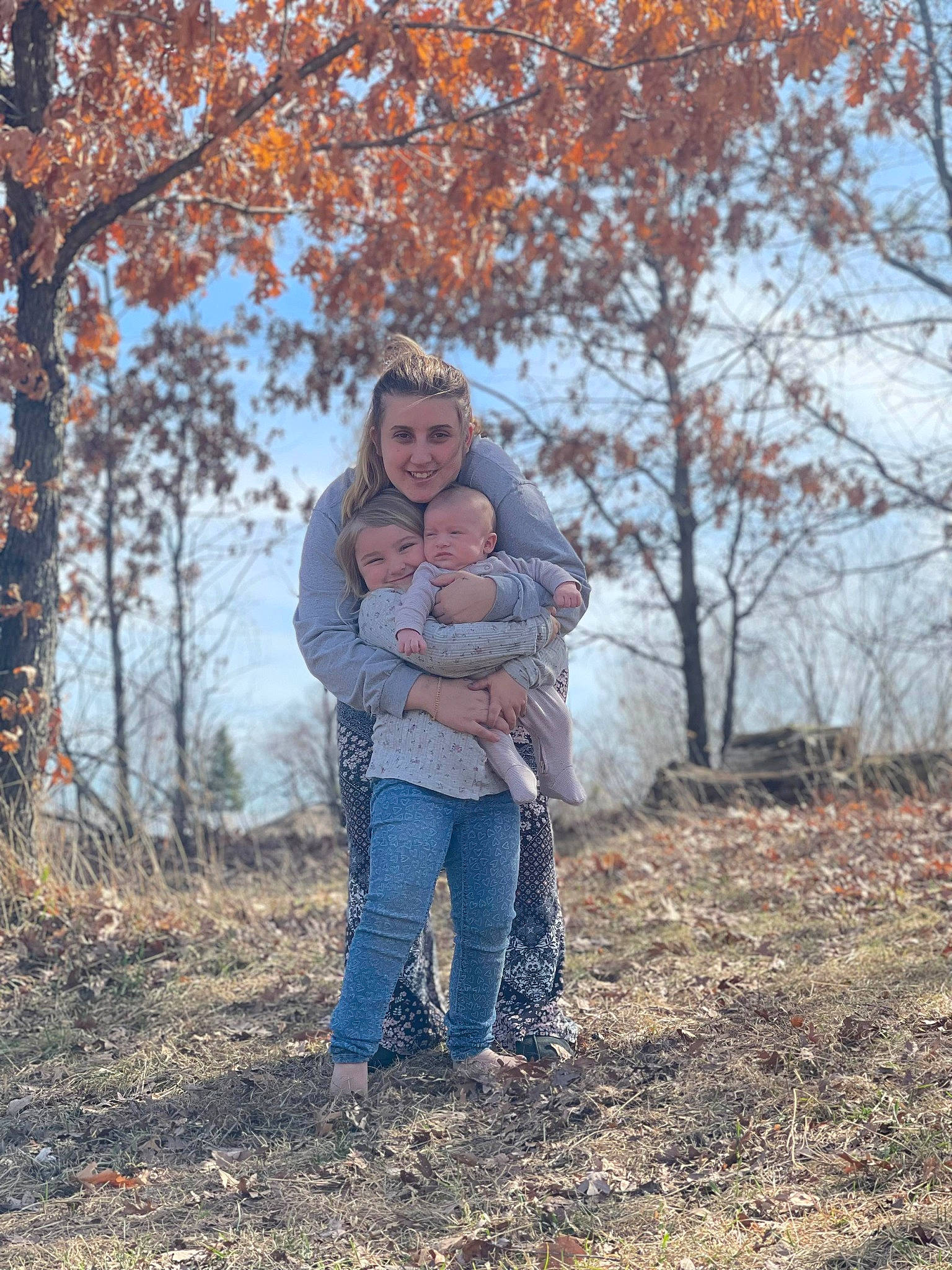 Leelind is registered to the contest to win money with this photo: deciduous, forest, gesture, grass, happy, joy, landscape, leisure, natural_landscape, people_in_nature, person, plant, recreation, sky, soil, sorrow, toddler, tree, trunk, twig