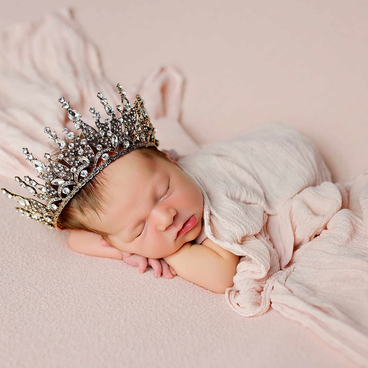 Leila joined the competition — help win amazing prizes! newborn, baby, sleeping, crown, infant, soft_fabric, pastel_colors, wrapped, portrait, peaceful, cute, head, face, resting, delicate, closeup, indoors, blanket, skin, tiny_hands