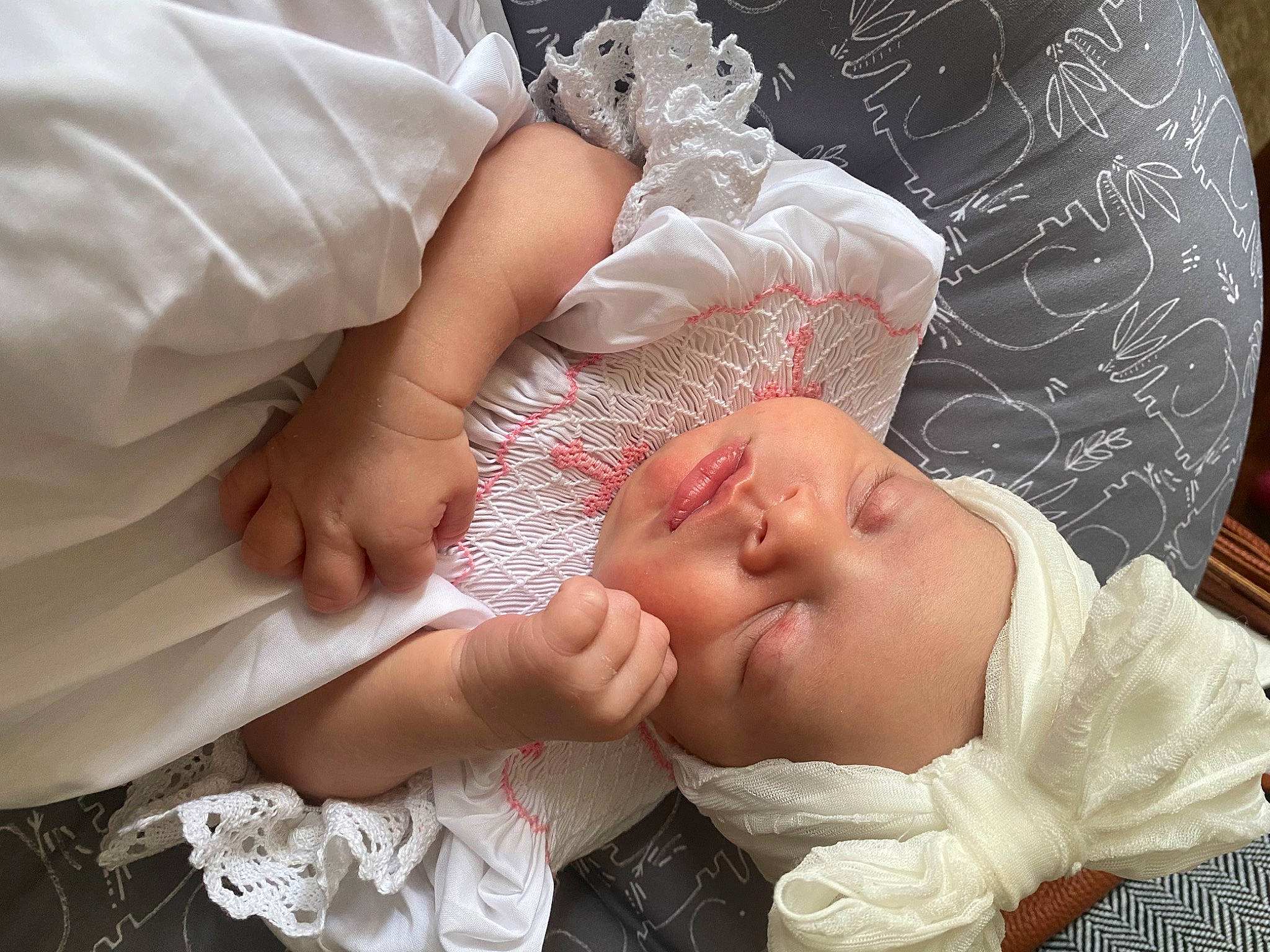Raelyn is registered to the contest to win money with this photo: baby, baby_products, baby_toddler_clothing, bridal_accessory, child, comfort, event, finger, gesture, hair_accessory, hand, happy, hat, headgear, headpiece, pattern, person, skin, textile, toddler
