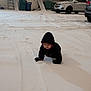 Elias joined the competition — help win amazing prizes! child, snow, winter, outdoor, cold, hooded_jacket, crawling, driveway, car, house, trees, daytime, footprints, gloves, residential, winter_clothing, nature, vehicle, season, person