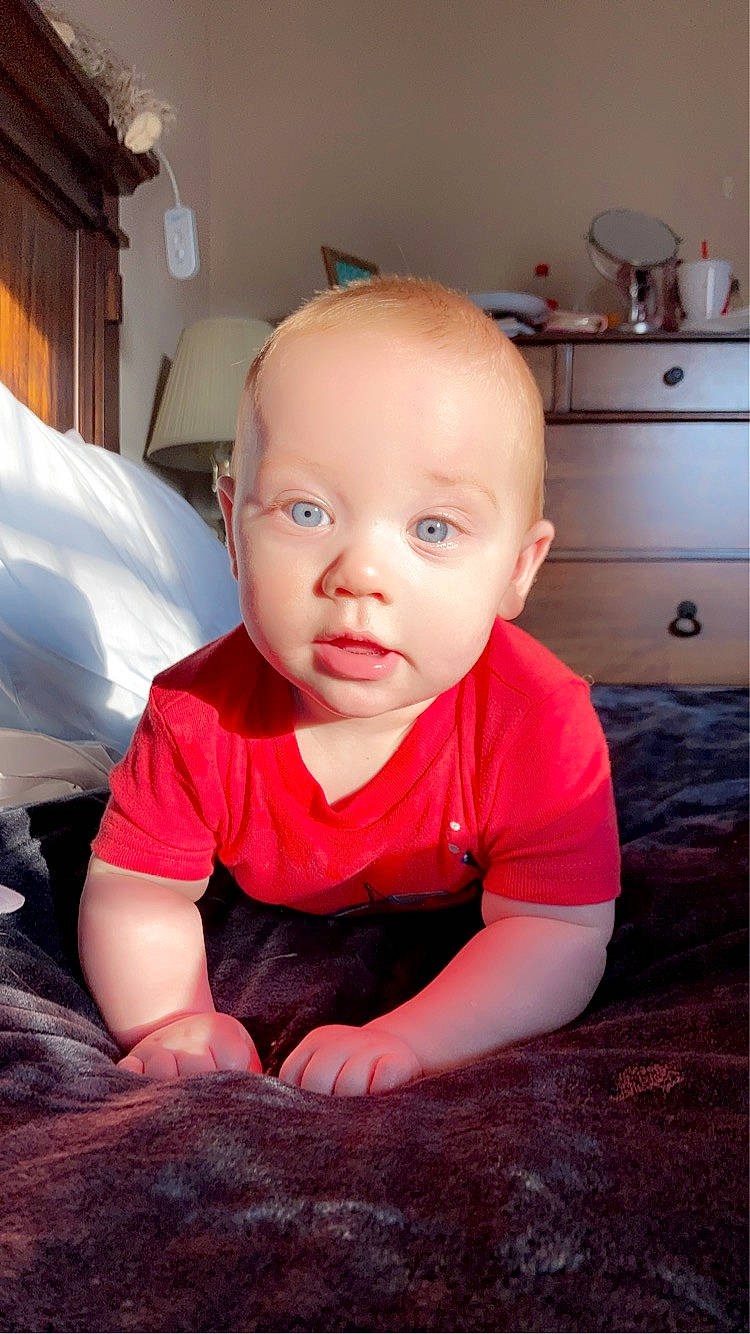 Teagan joined the competition — help win amazing prizes! baby, baby_toddler_clothing, cabinetry, child, countertop, crawling, cupboard, drawer, eye, flash_photography, floor, flooring, happy, hardwood, head, kitchen, kitchen_appliance, person, t_shirt, toddler