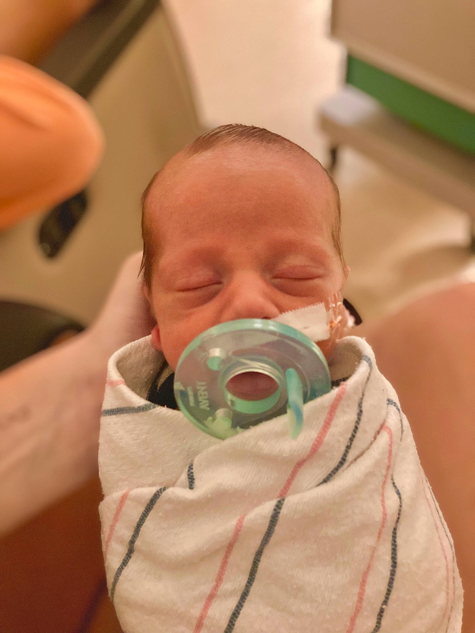 Teagan joined the competition — help win amazing prizes! baby, baby_products, baby_toddler_clothing, cheek, comfort, drinkware, ear, eye, eyelash, finger, head, health_care, hospital, iris, medical, medical_equipment, neck, nose, person, thumb