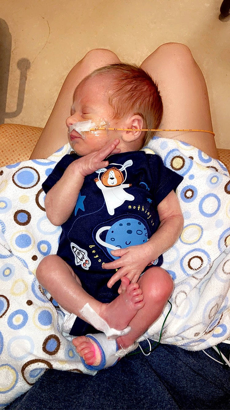 Teagan joined the competition — help win amazing prizes! azure, baby, baby_products, baby_toddler_clothing, child, comfort, electric_blue, hairstyle, happy, human_leg, iris, pattern, person, product, sitting, skin, sleeve, sock, t_shirt, thigh