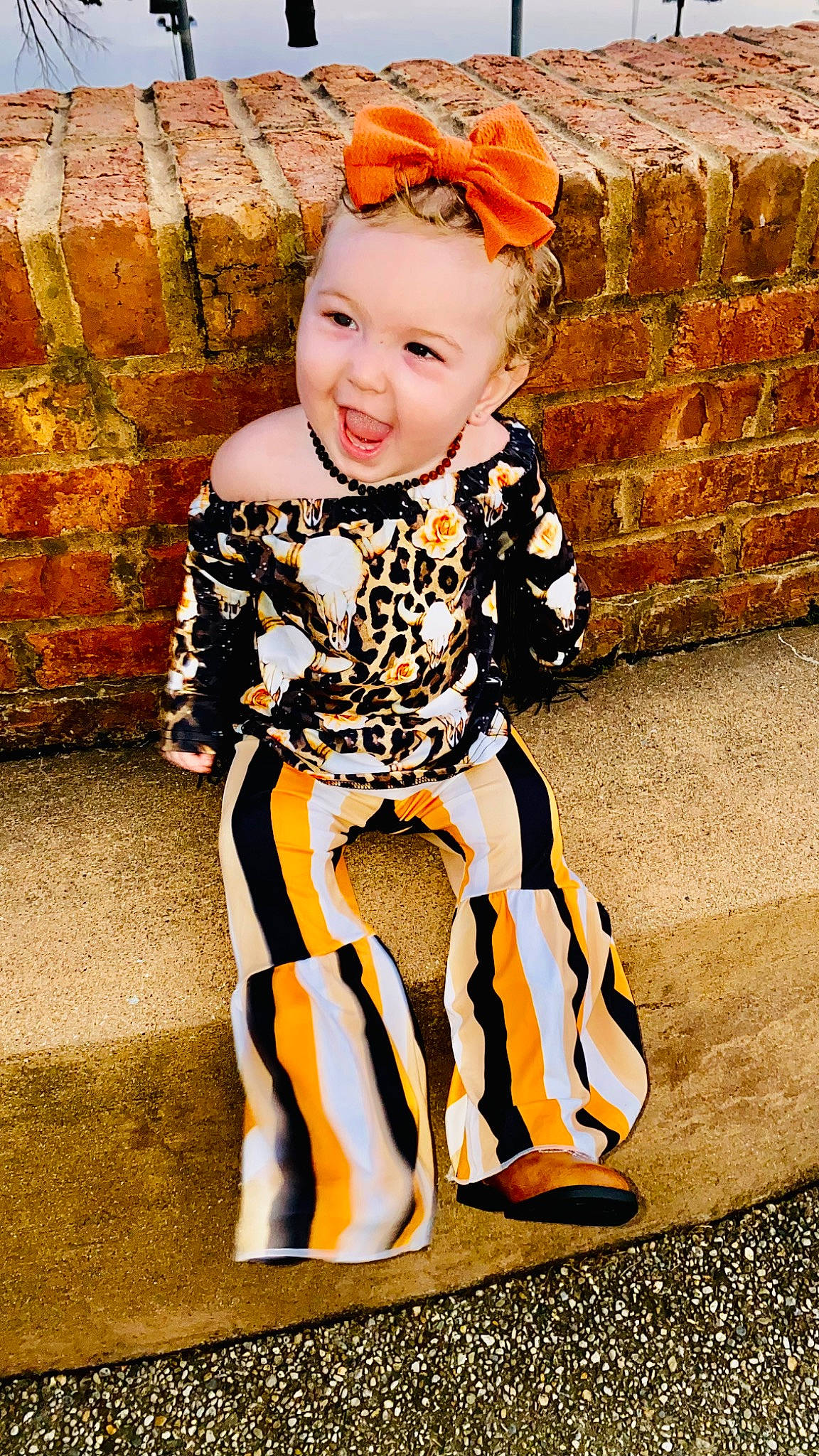 Arizona joined the competition — help win amazing prizes! baby, baby_toddler_clothing, brick, child, costume_hat, eye, face, fashion_accessory, fun, happy, head, human_leg, orange, pattern, person, sitting, sleeve, smile, t_shirt, thigh